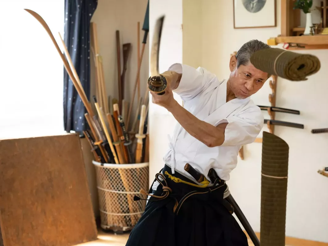 Samurai training under the guidance of an expert swordsman